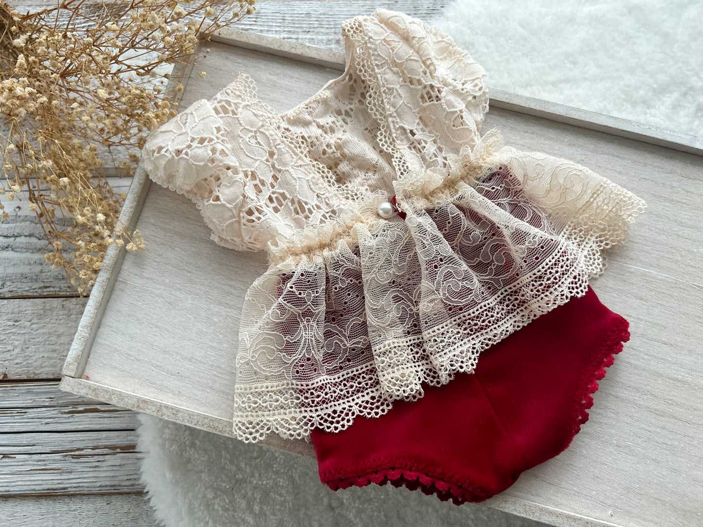 Elegant red and cream newborn romper with lace details, perfect for photo sessions. A delicate and festive baby girl photography prop, handmade with care.