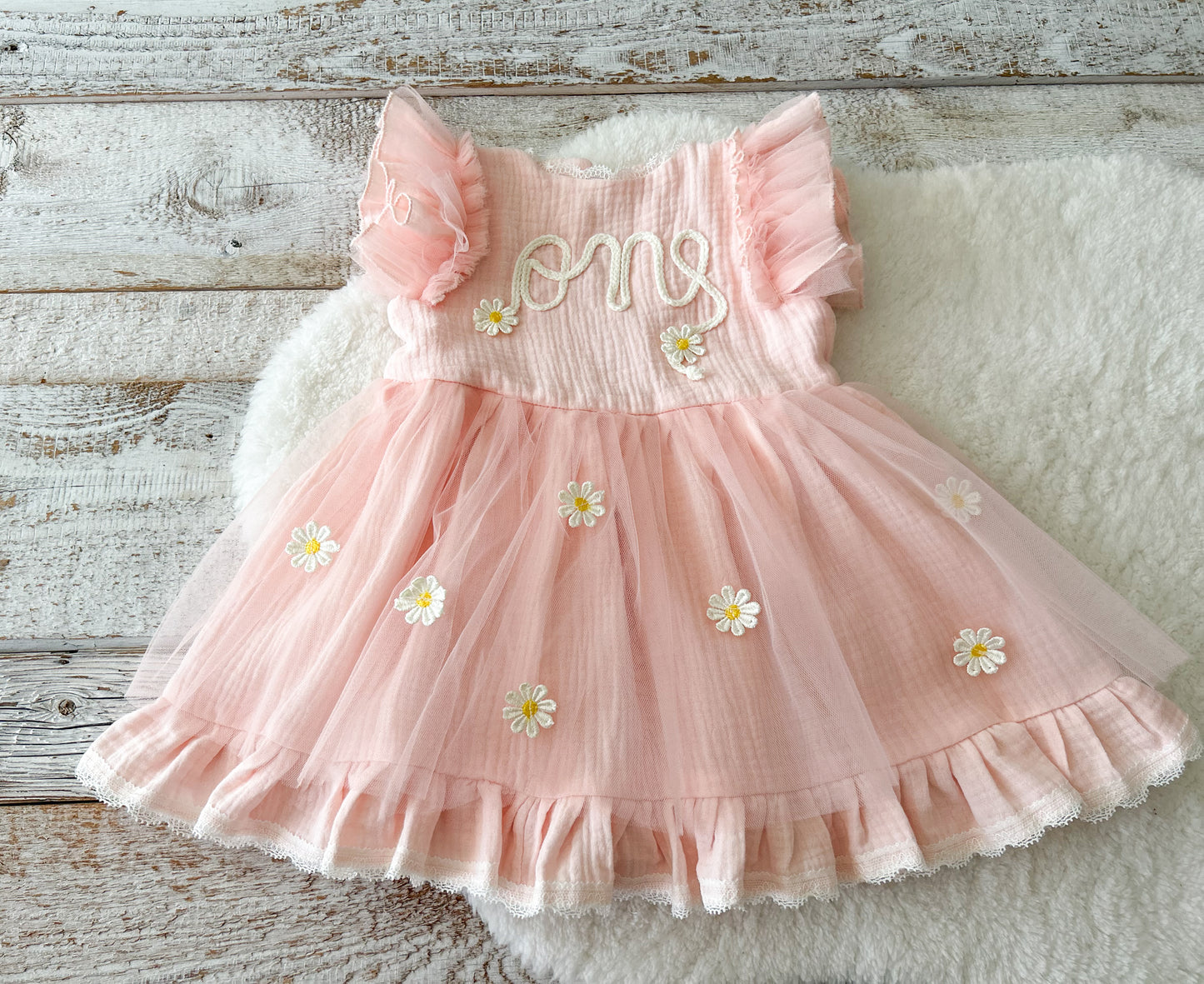 One year old baby girl birthday dress with embroidered front and pastel color pink