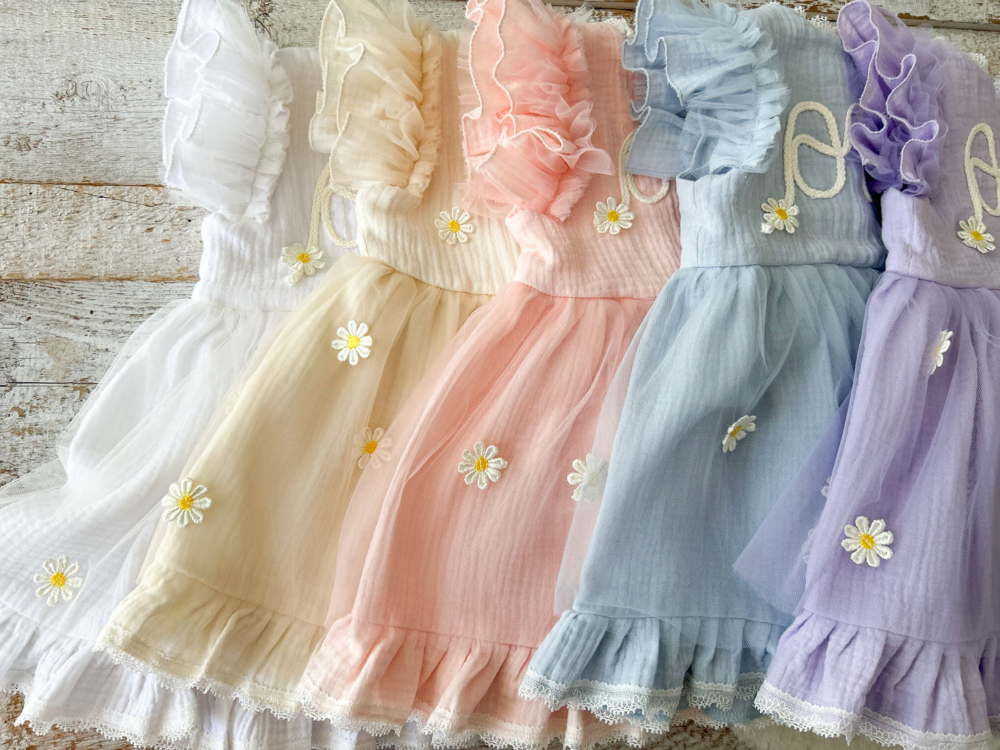 ne year old baby girl birthday dress with embroidered front and pastel color