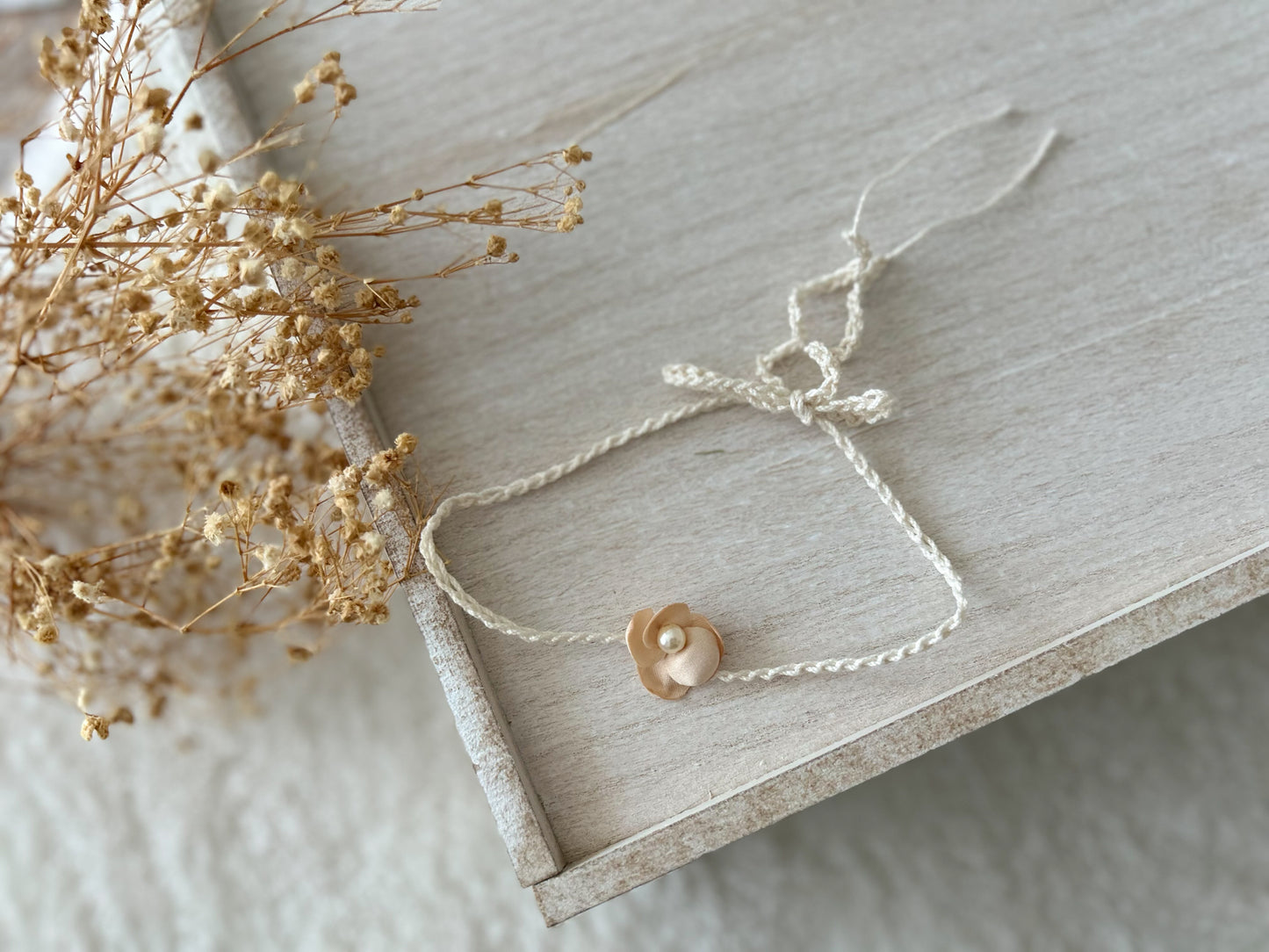 Soft baby girl headbands for photos, featuring blush tones and handmade embellishments.