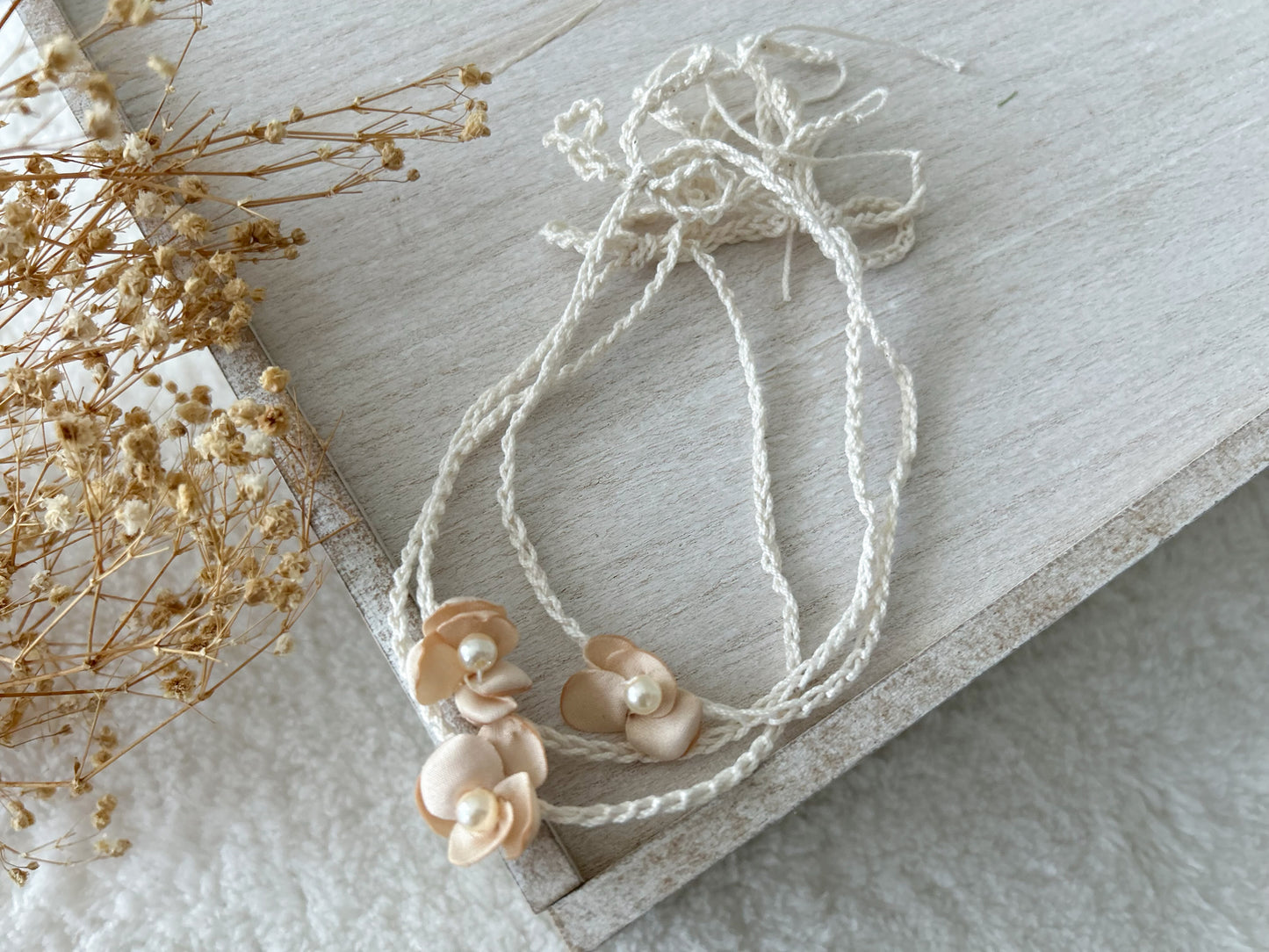 Soft baby girl headbands for photos, featuring blush tones and handmade embellishments.