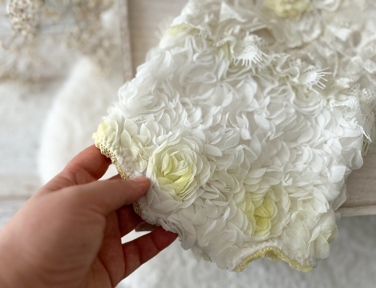 close up on the floral 3D ruffled romper