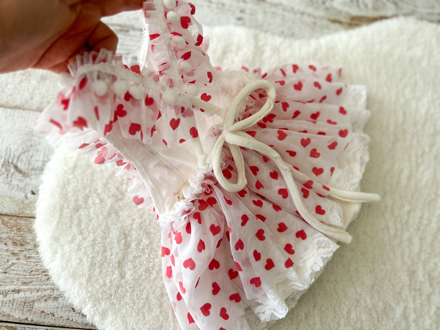 Back of baby heart romper dress with tie closure and lace layers – cute Valentine outfit for baby girl
