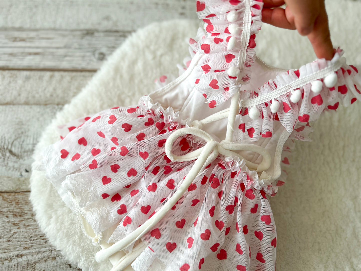 Back of baby heart romper dress with tie closure and lace layers – cute Valentine outfit for baby girl