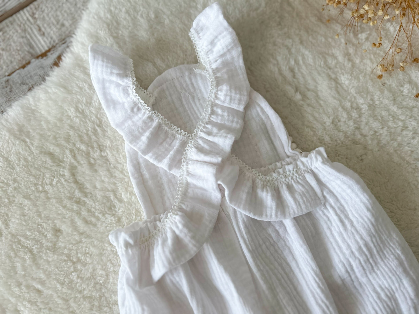 Detail of the back of this baby girl photo romper