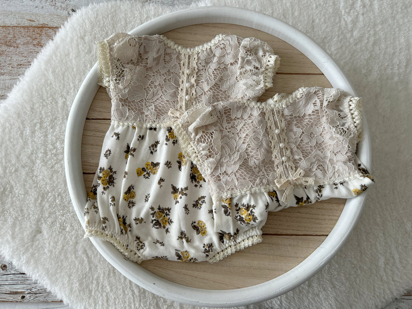 Two vintage-inspired newborn rompers with lace and yellow roses – side by side styling