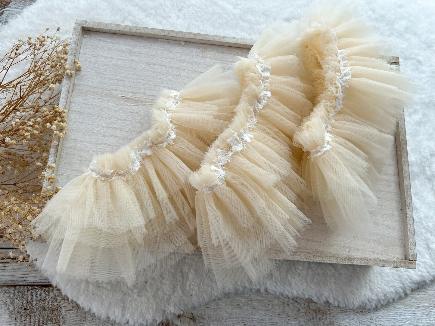 Newborn tutu skirts made of soft tulle with lace decoration on the waistline