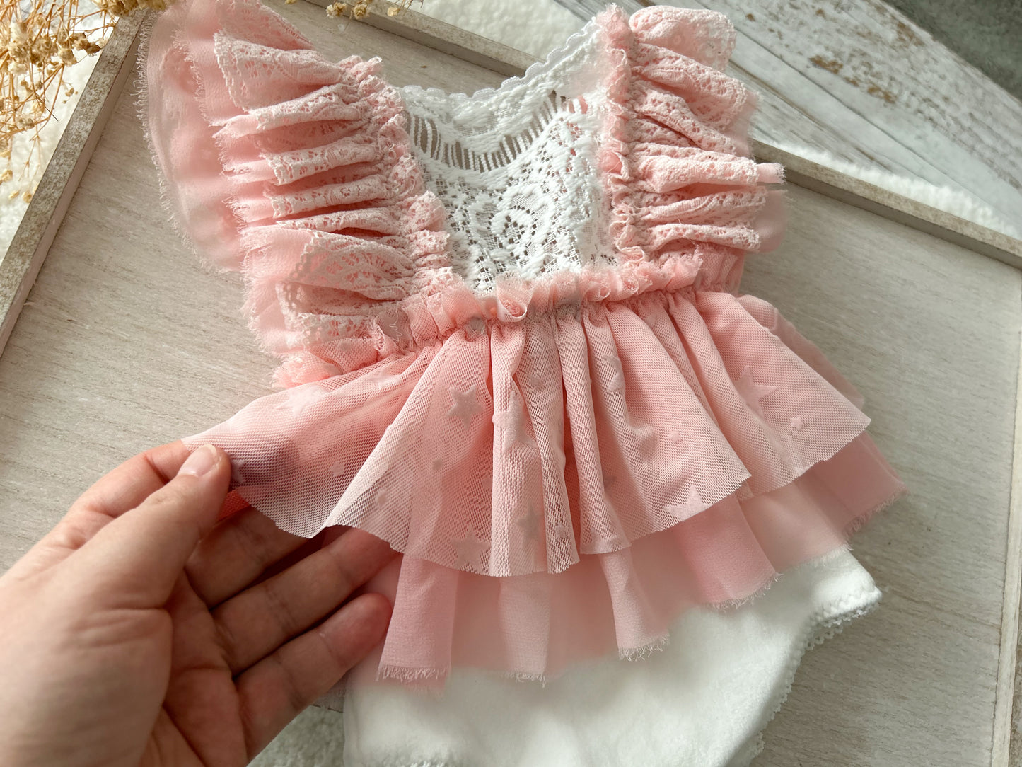 Newborn ruffled romper pink boho style for first photo shoot