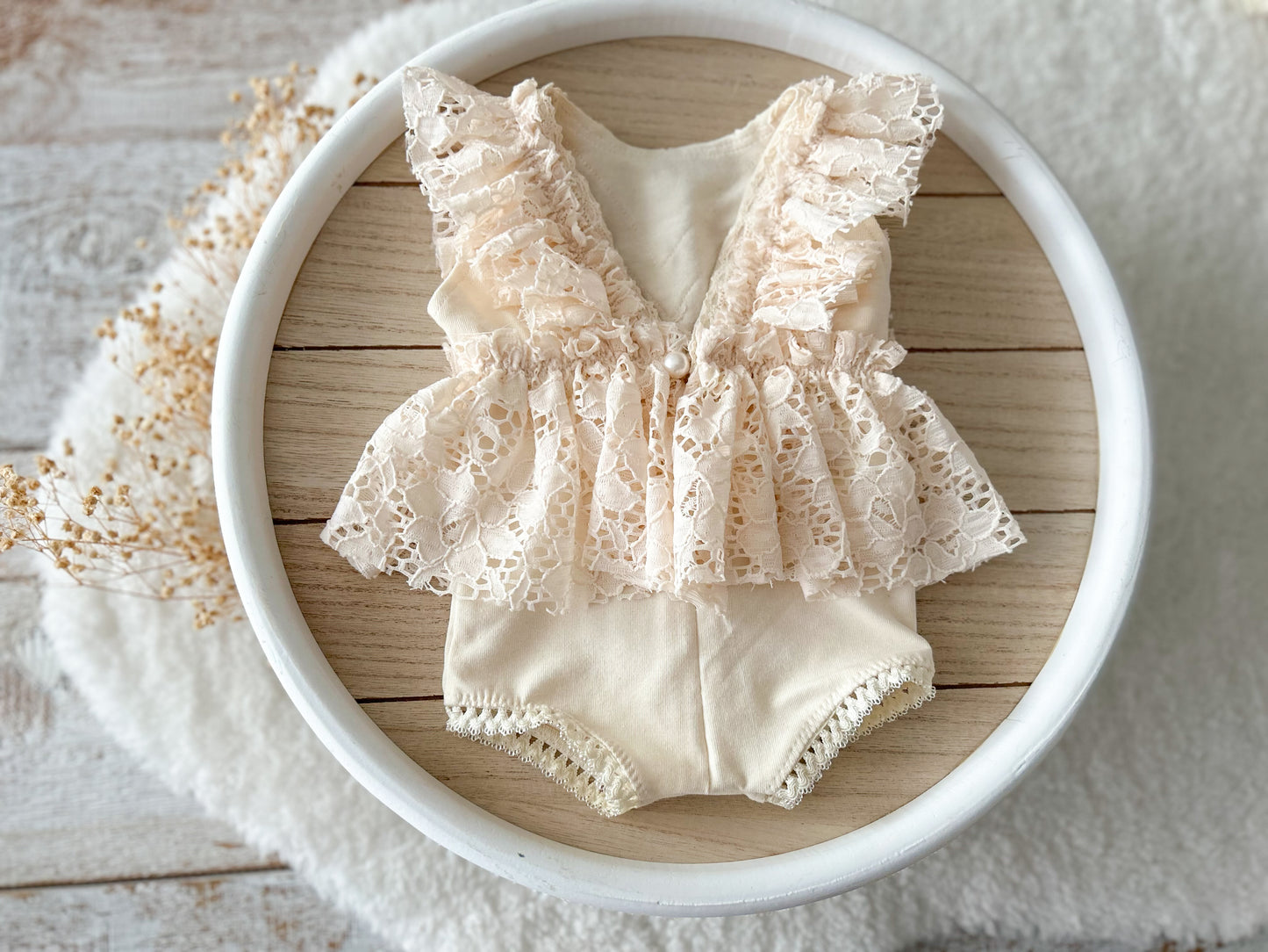 The back of the newborn photo outfit with lace ruffles, vintage boho style