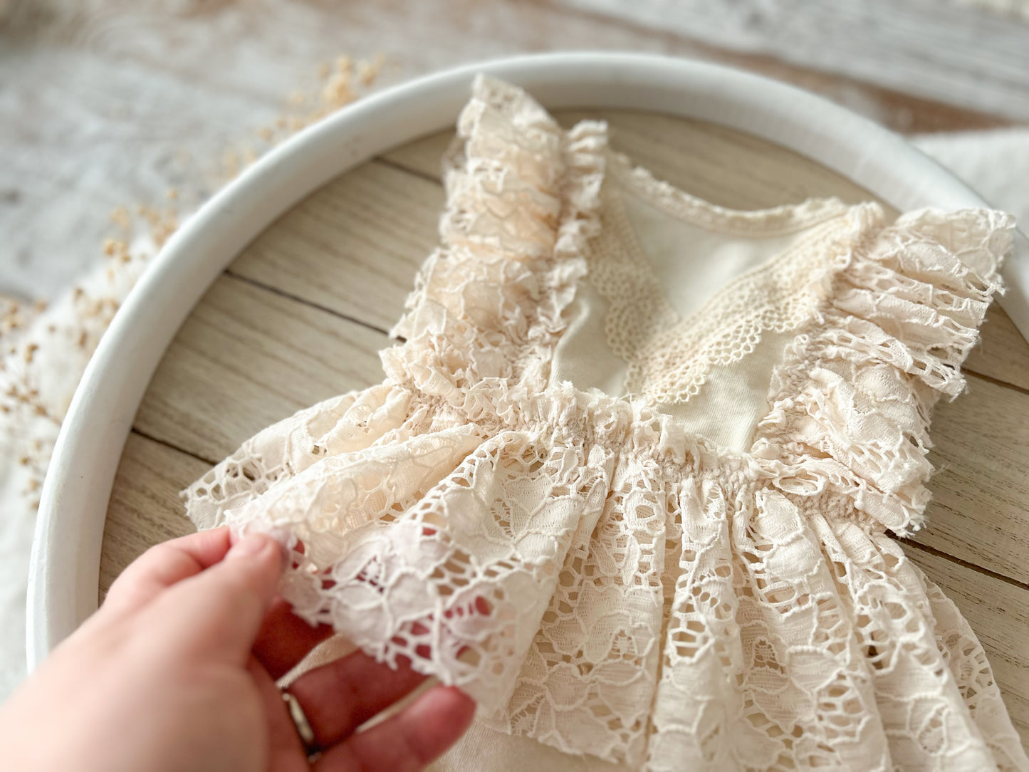 Newborn lace romper with ruffles for professional photography shoots