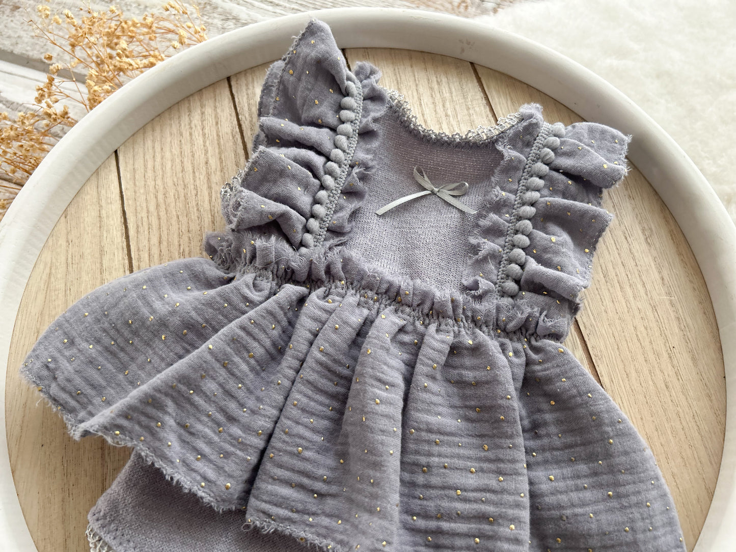 Newborn romper made of muslin fabric with golden dots, boho style perfect for summer newborn photo shoots