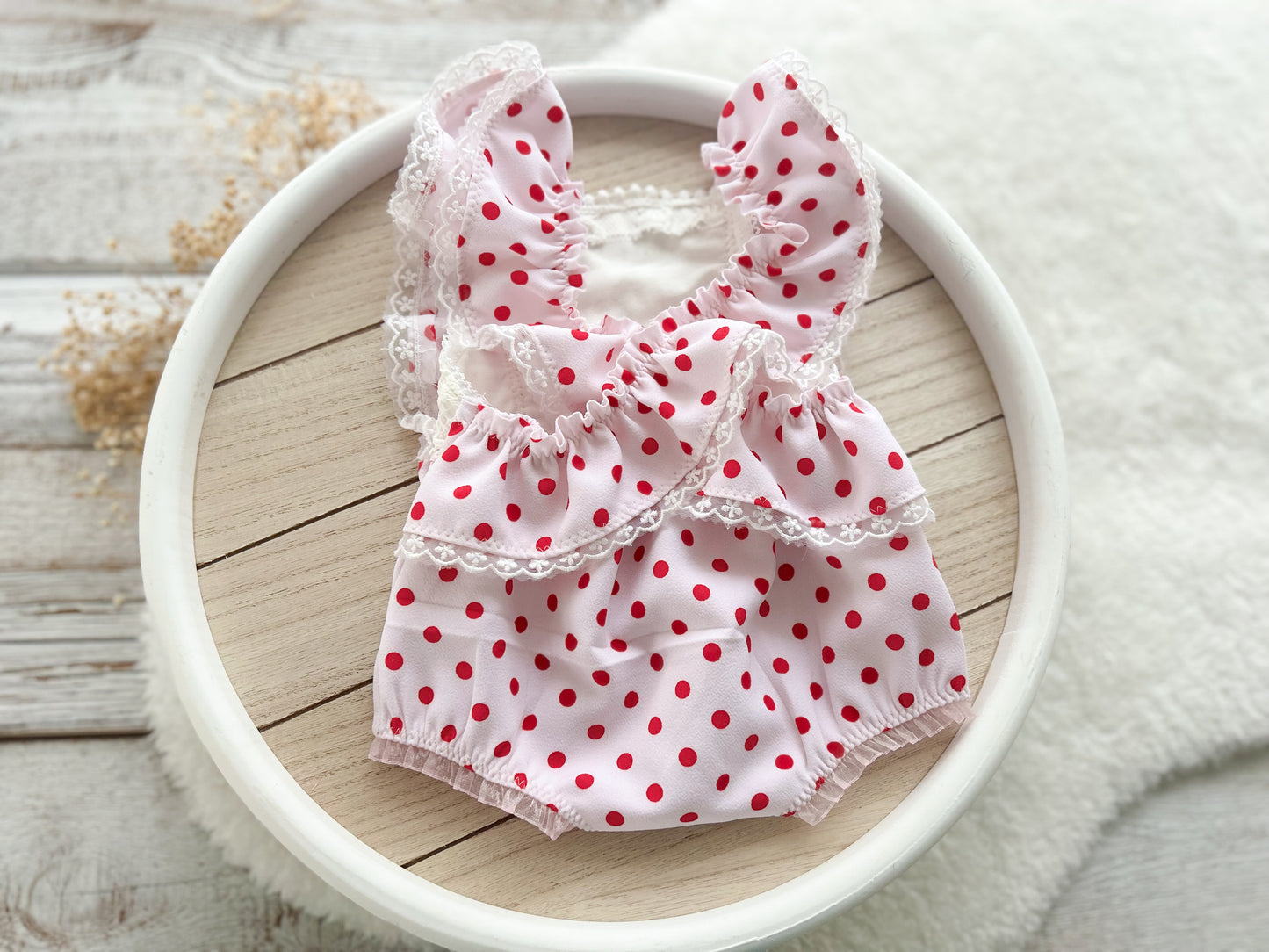 ruffled romper for newborn girl first photo shoot