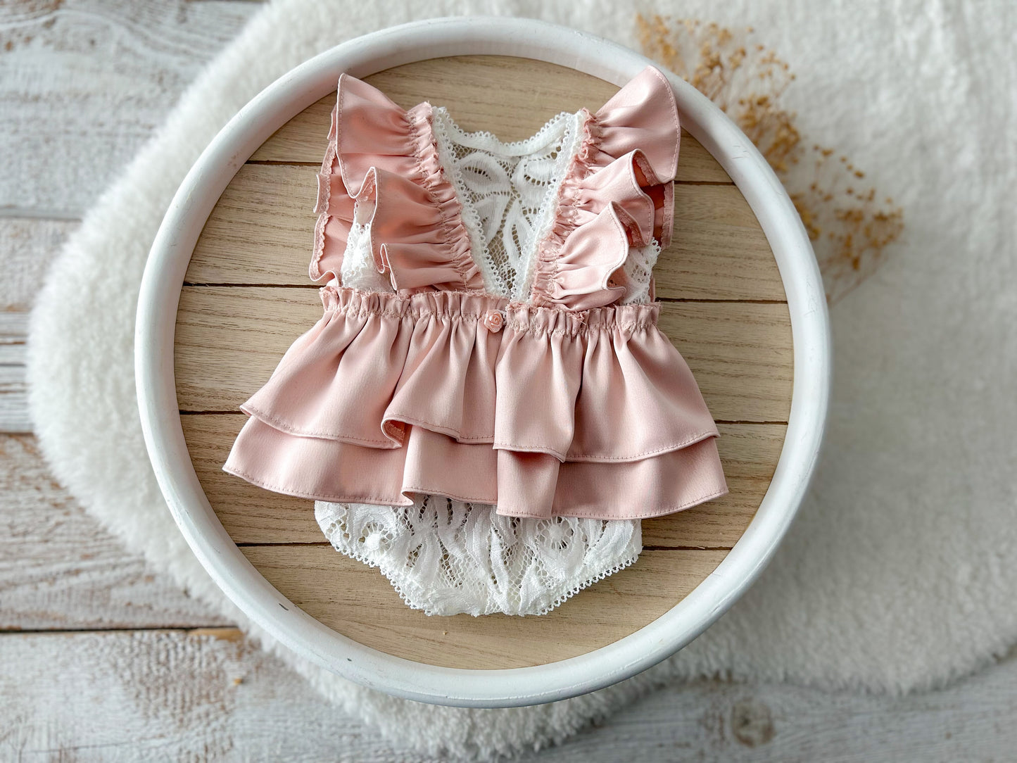Baby girl outfit with satin shoulder ruffles and layered ruffle back