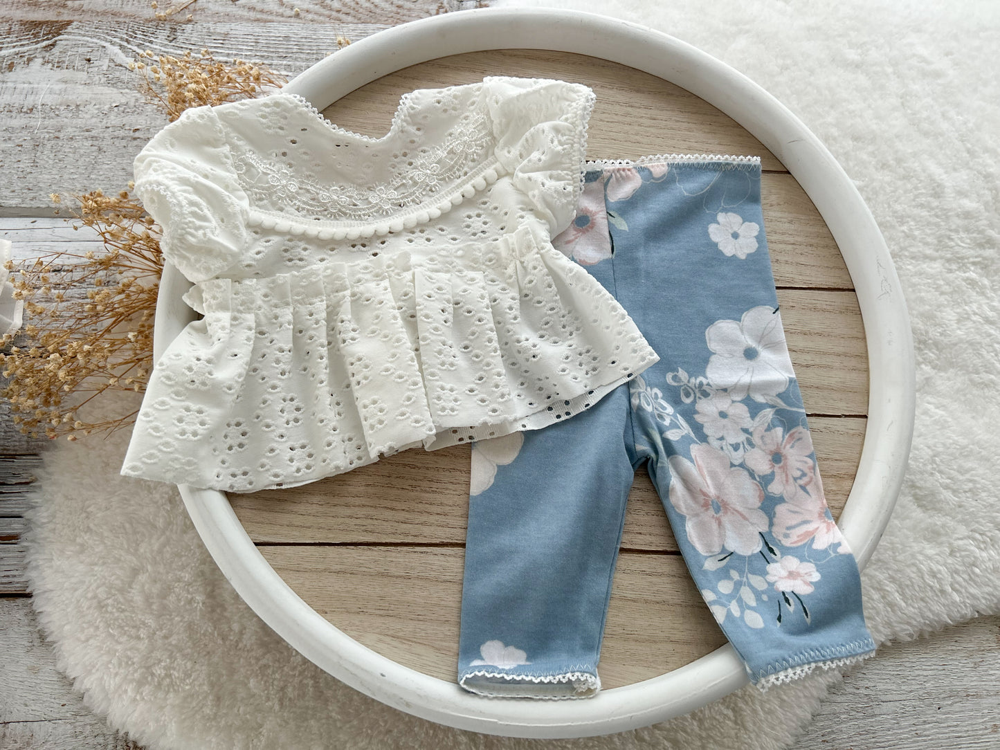 3-piece baby girl photo prop with eyelet top, floral leggings, and matching ruffle pillow