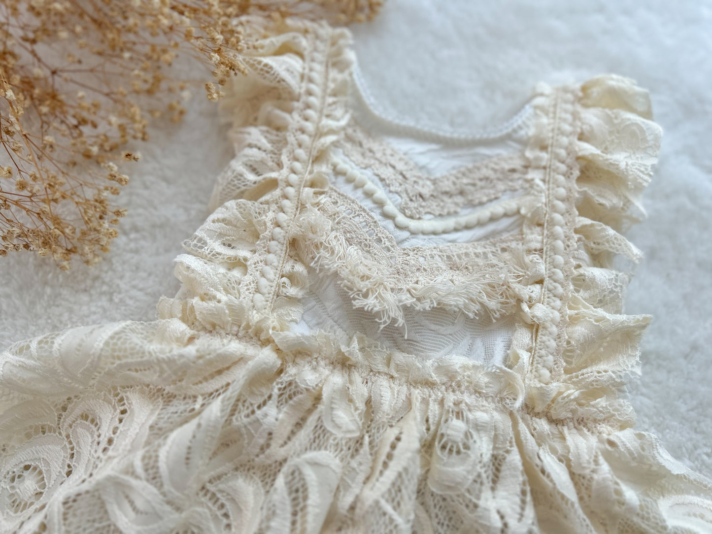Close-up of intricate lace fabric with a soft focus background