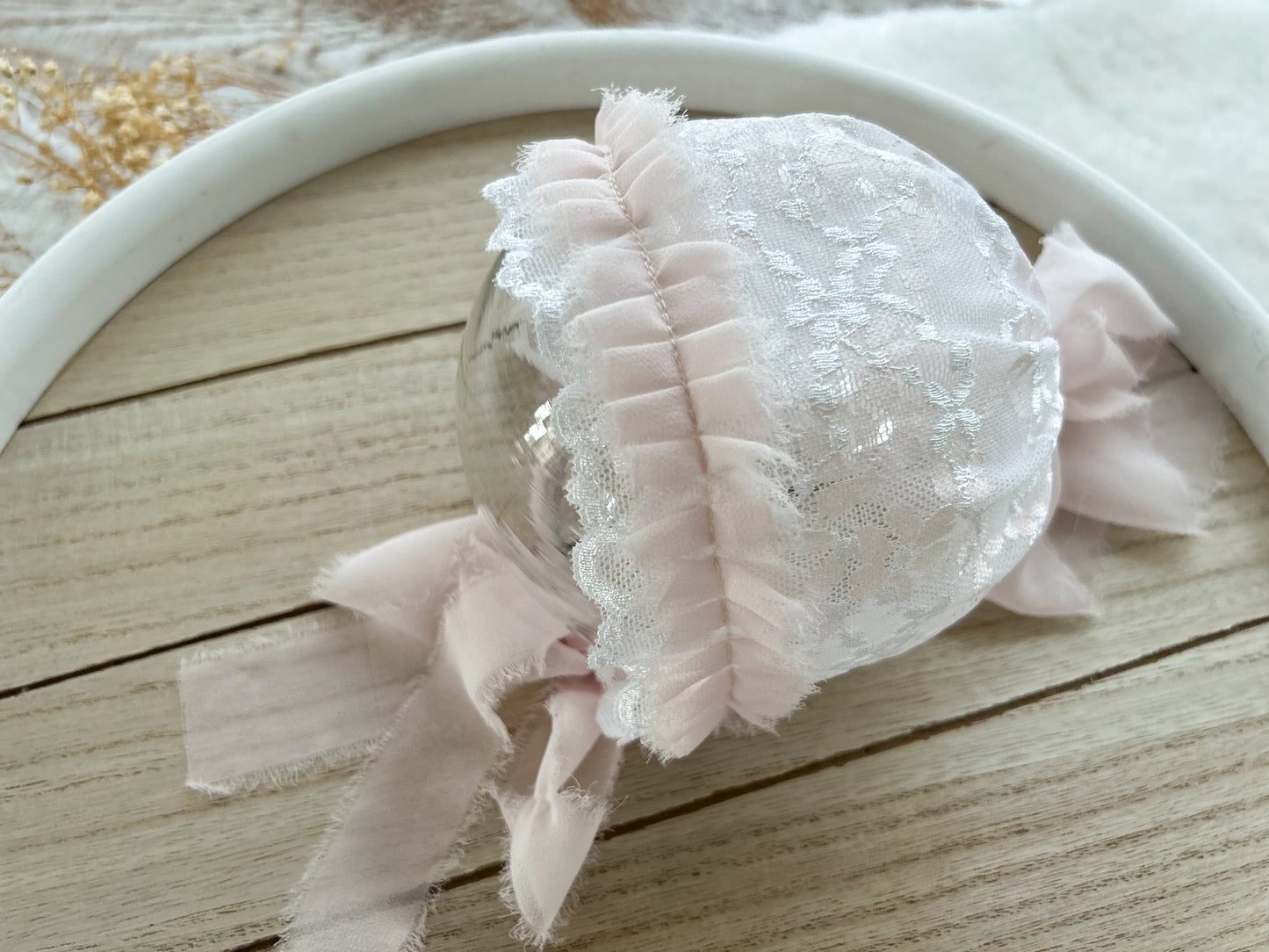 Newborn lace bonnet with chiffon ruffles