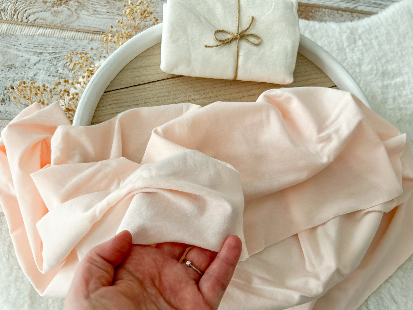 Blush pink newborn wrap for swaddling in newborn photography