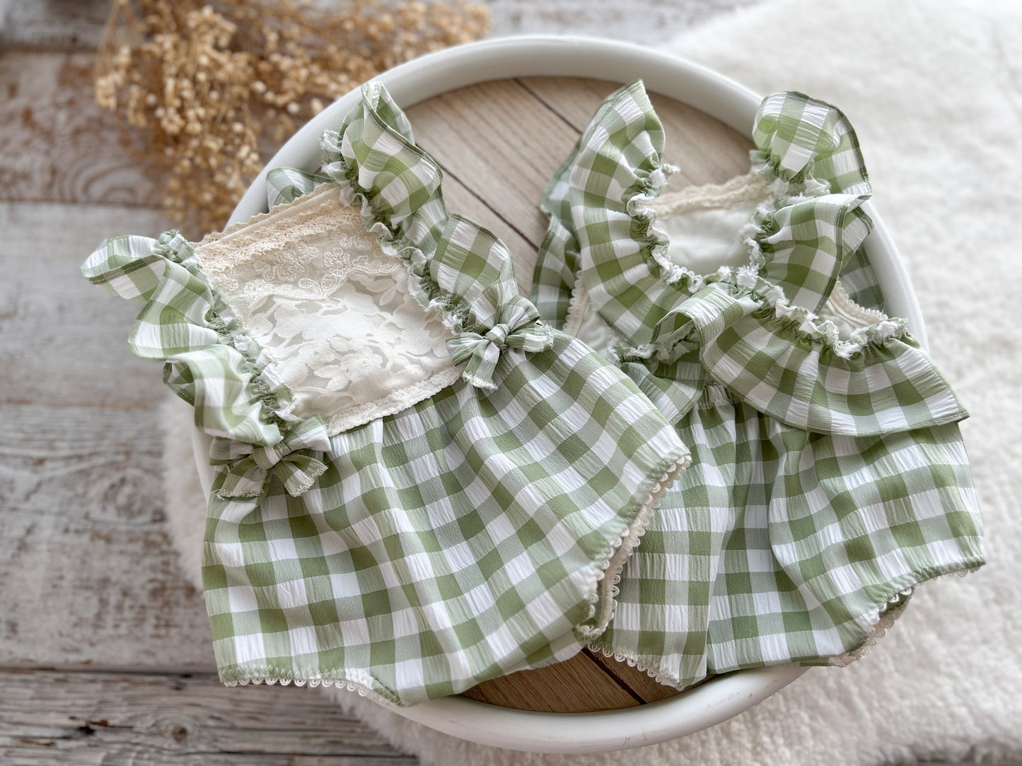 The front and back of the romper for newborn girl first photo shoot
