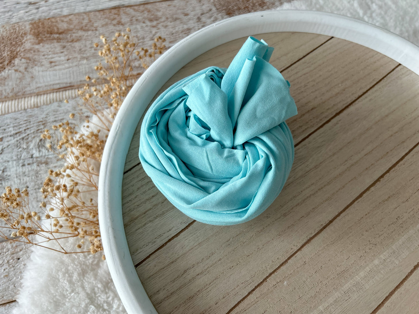 Pale aqua blue swaddle wrap, ideal for newborn photography.