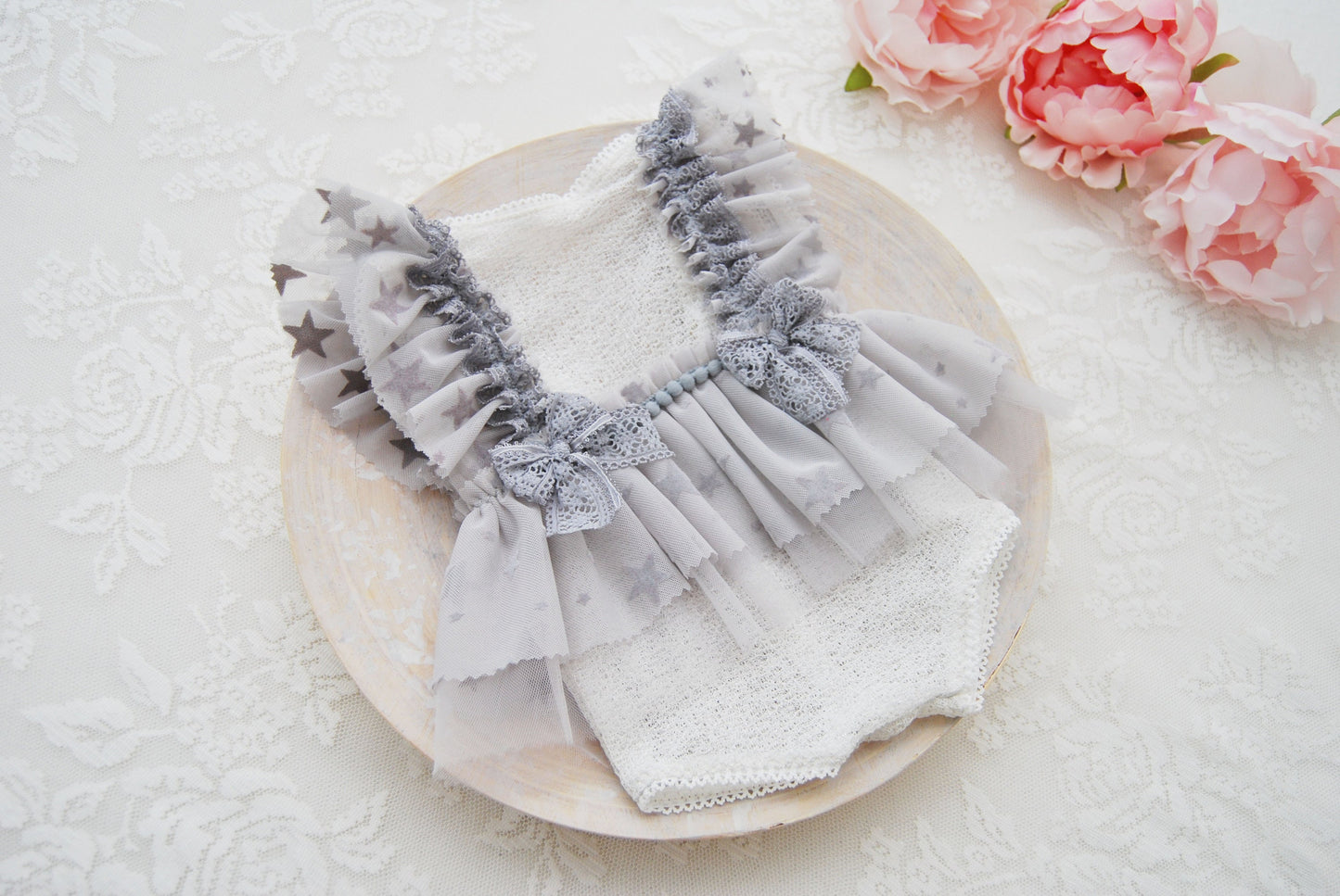 Gray newborn romper for photograph shoots with lace ruffled skirt. Ideal as baby shower gift, newborn photo prop