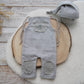 Neutral gray baby boy photo outfit: romper and sleepy hat
