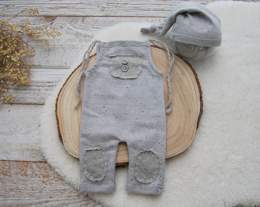 Neutral gray baby boy photo outfit: romper and sleepy hat