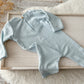 Newborn photography outfit with knit texture and pastel tones, perfect for boys.