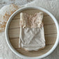 Beige newborn romper with fringe lace detail ideal for newborn photography