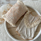 Newborn romper and matching pillow with boho lace