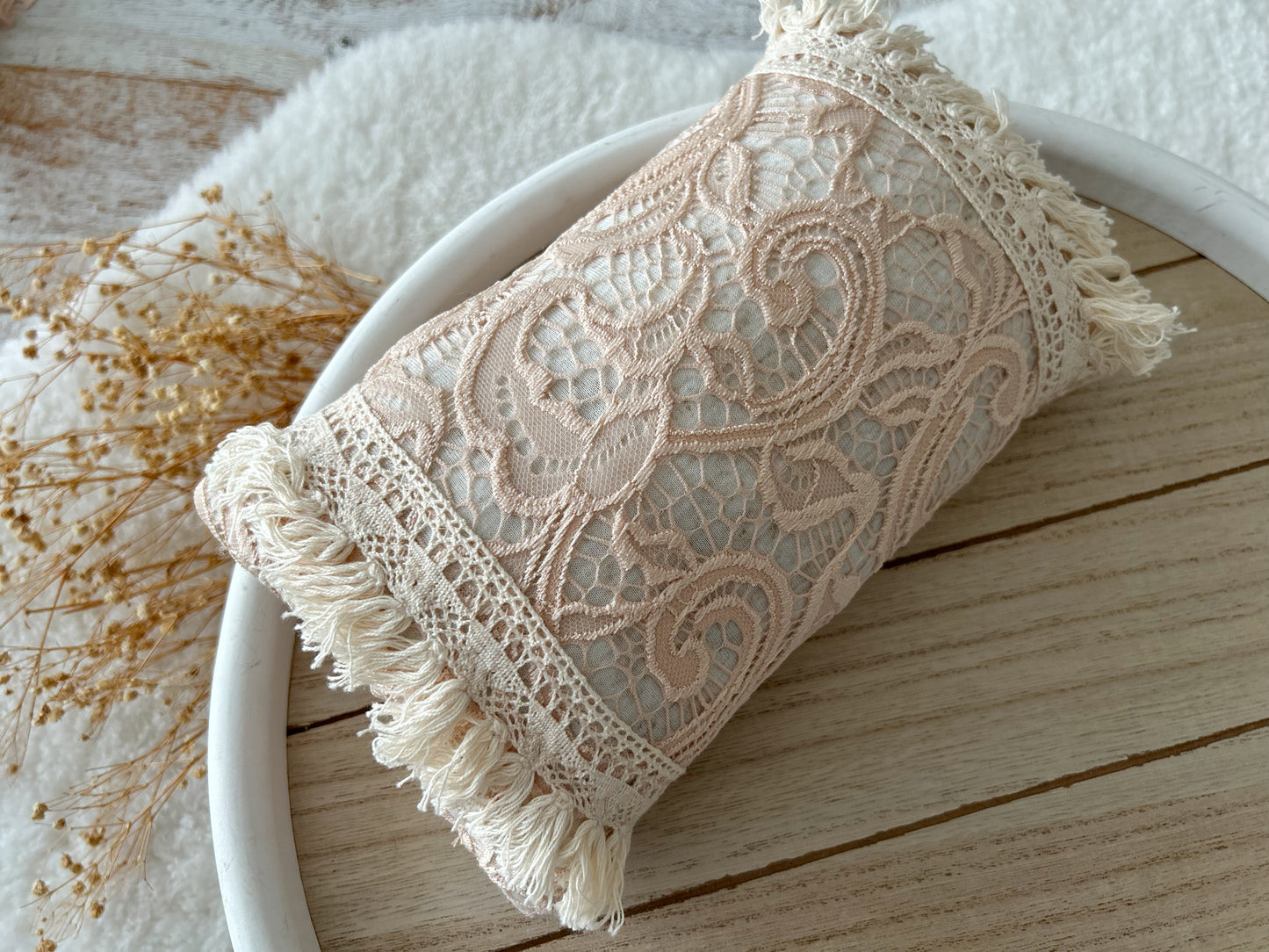 Newborn pillow for photo shoots, lace boho style with fringes.