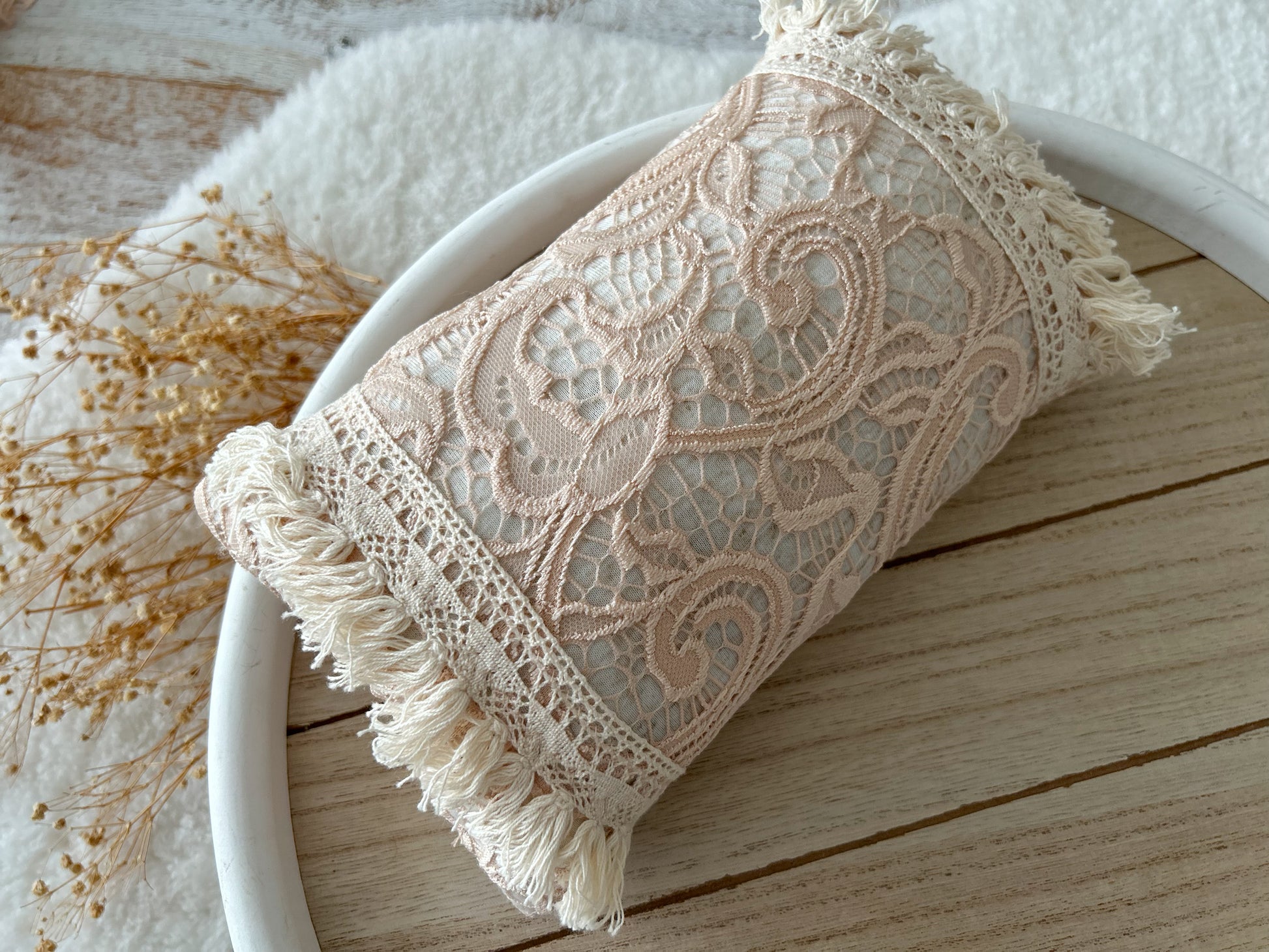 Newborn pillow for photo shoots, lace boho style with fringes.