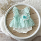 Newborn girl photo outfit in Light mint color floral details on a wooden surface