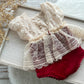 Elegant red and cream newborn romper with lace details, perfect for photo sessions. A delicate and festive baby girl photography prop, handmade with care.


