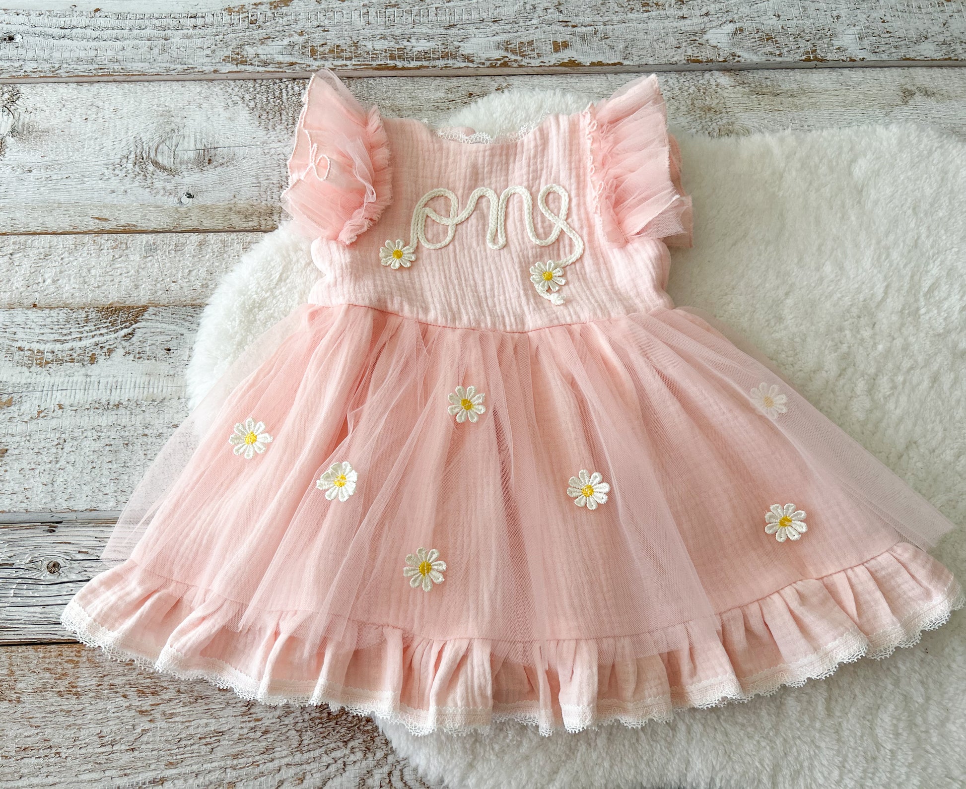 One year old baby girl birthday dress with embroidered front and pastel color pink