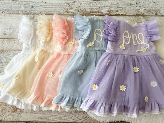 Baby girl first birthday dress with “one” embroidered on front, pastel daisy tulle