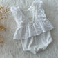All white ruffled romper for newborn photo shoots