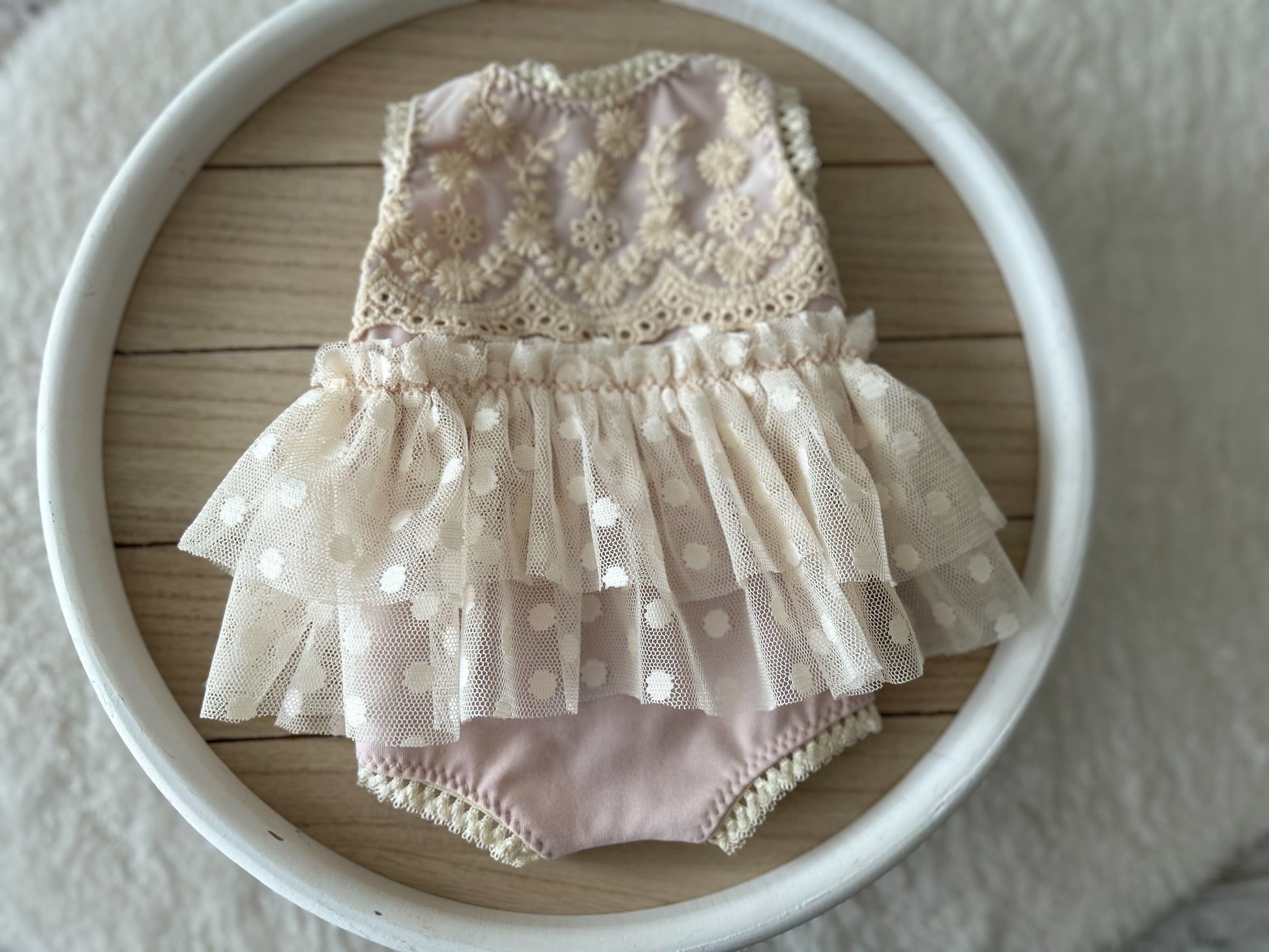 Newborn photo romper in blush pink with ivory tulle polka dot skirt – flat lay front view