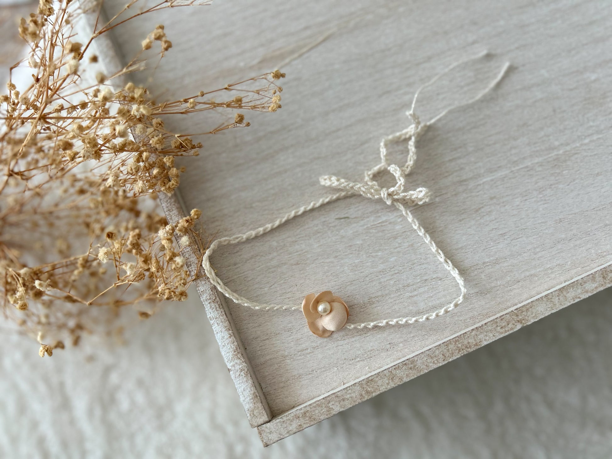 Soft baby girl headbands for photos, featuring blush tones and handmade embellishments.