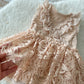 Close-up of lace and angora fabric on baby girl romper for milestone photoshoots