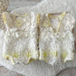 newborn textured romper for first photo shoot in light yellow color. 