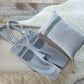 Newborn boy suspender pants and posing pillow in light blue gray color with texture
