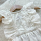 White lace sitter outfit made of muslin with ruffles, perfect as sitter photography outfit