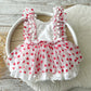 Baby girl heart romper dress with red hearts, ruffle straps, and lace details – perfect for Valentine’s Day