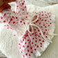 Back of baby heart romper dress with tie closure and lace layers – cute Valentine outfit for baby girl
