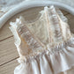 Neutral baby girl romper with double ruffle skirt for photoshoots