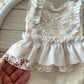 Detailed view of lace ruffled skirt of newborn photo outfit