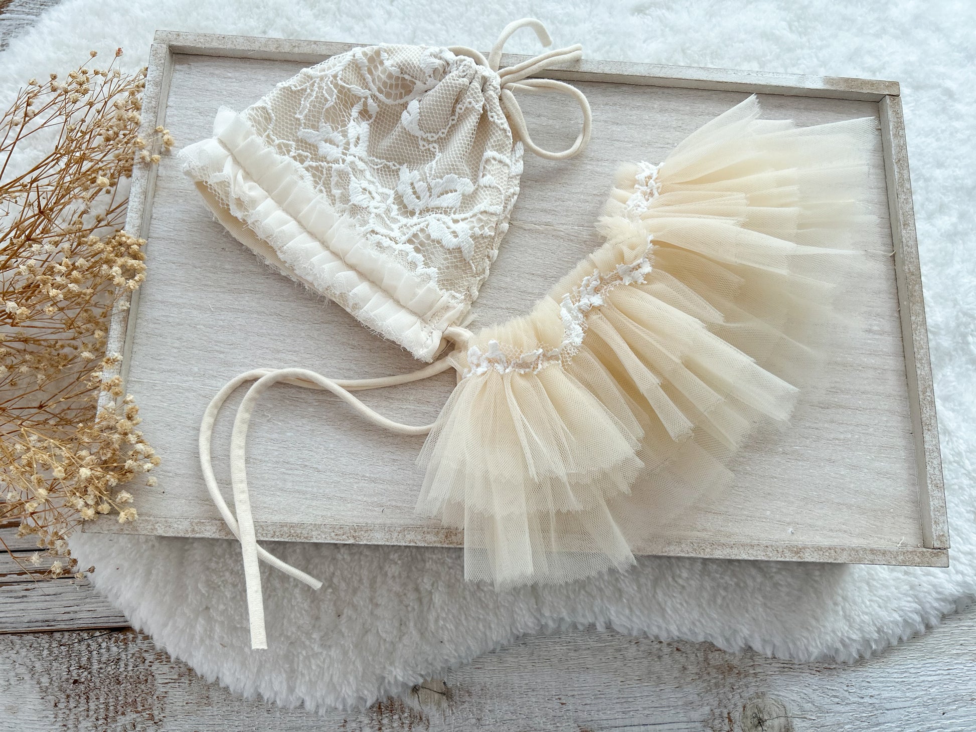 Newborn girl outfit: bonnet and ruffled tulle tutu skirt in warm beige