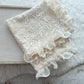Ruffled newborn layer that is decorated with ruffles on margins.