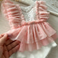 Newborn ruffled romper pink boho style for first photo shoot
