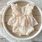 The back of the newborn photo outfit with lace ruffles, vintage boho style